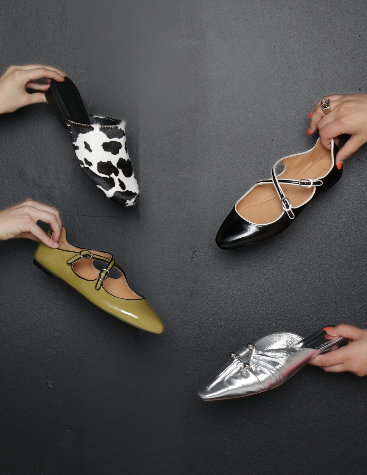 Four pairs of shoes with different designs on a black background